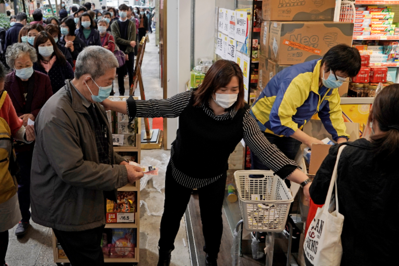 AS the number of known virus cases in Hong Kong topped 40 long lines of shoppers are stocking up on supplies.
