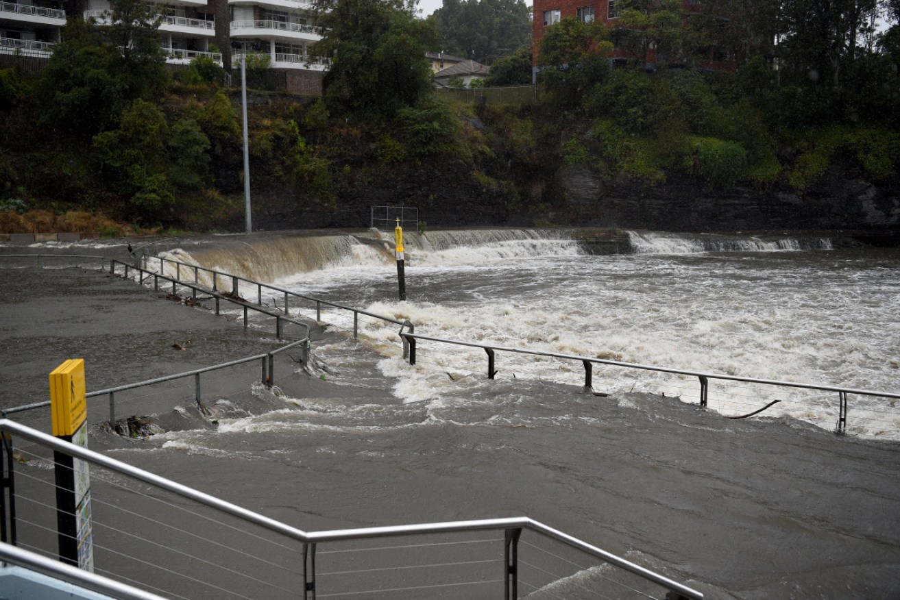 Heavy rain flooded the Parramatta River on Friday afternoon, as thousands of commuters struggled to make the trip home.