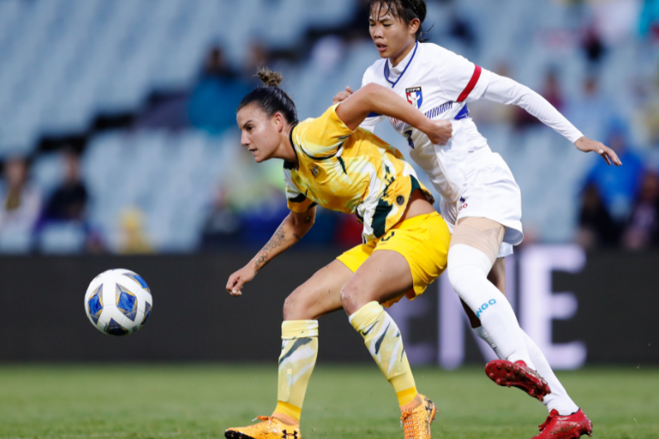 Caitlin Foord gets the better of Taipei's Li-Ping Zhuo during the Round 3 match of the AFC Women's Olympic Qualifying Tournament  at Campbelltown Stadium in Sydney.