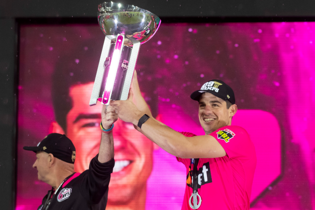 Moises Henriques hoists the BBL trophy after his Sixers put the Stars to the sword.