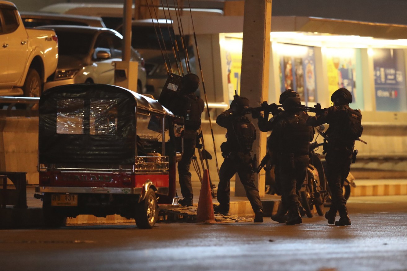 A group of armed commando soldiers are seen outside Terminal 21 Korat mall, in Nakhon Ratchasima.