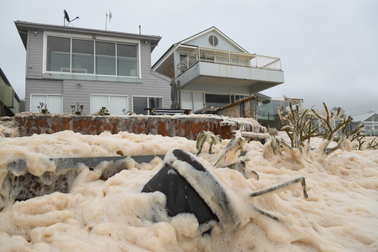 Sea foam brought by high waves at beachfront Collaroy, on Sydney's northern beaches, on Monday.