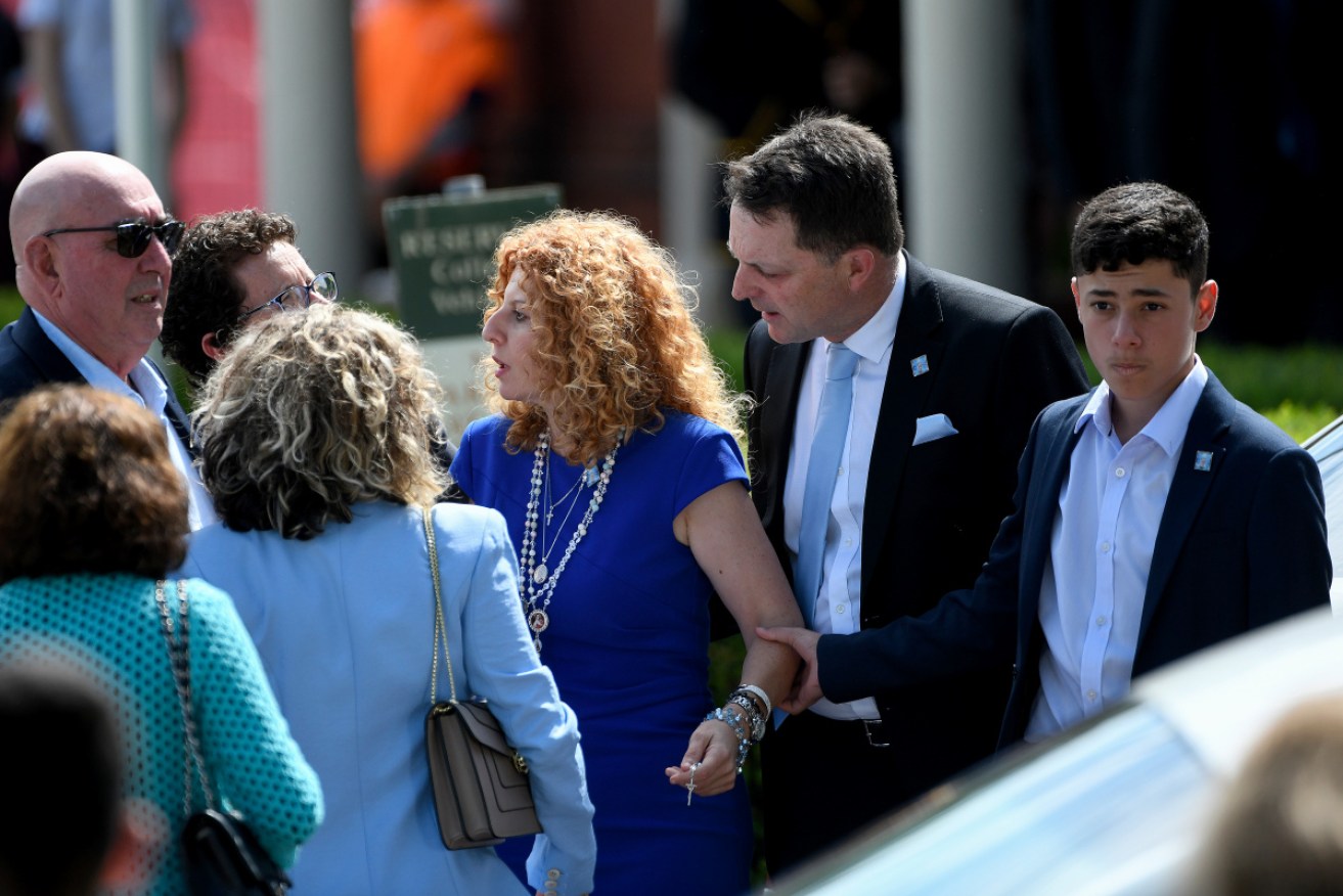 Veronique's mother Bridget Sakr her partner Craig Mackenzie and son Michael arrive for the funeral.