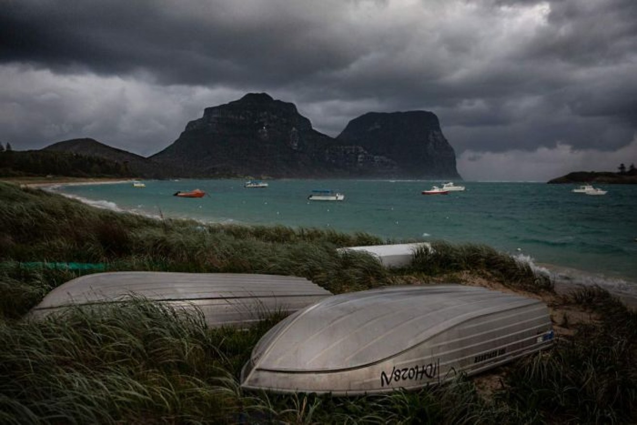 Boats line a beach on Lord Howe Island during a 2019 storm.