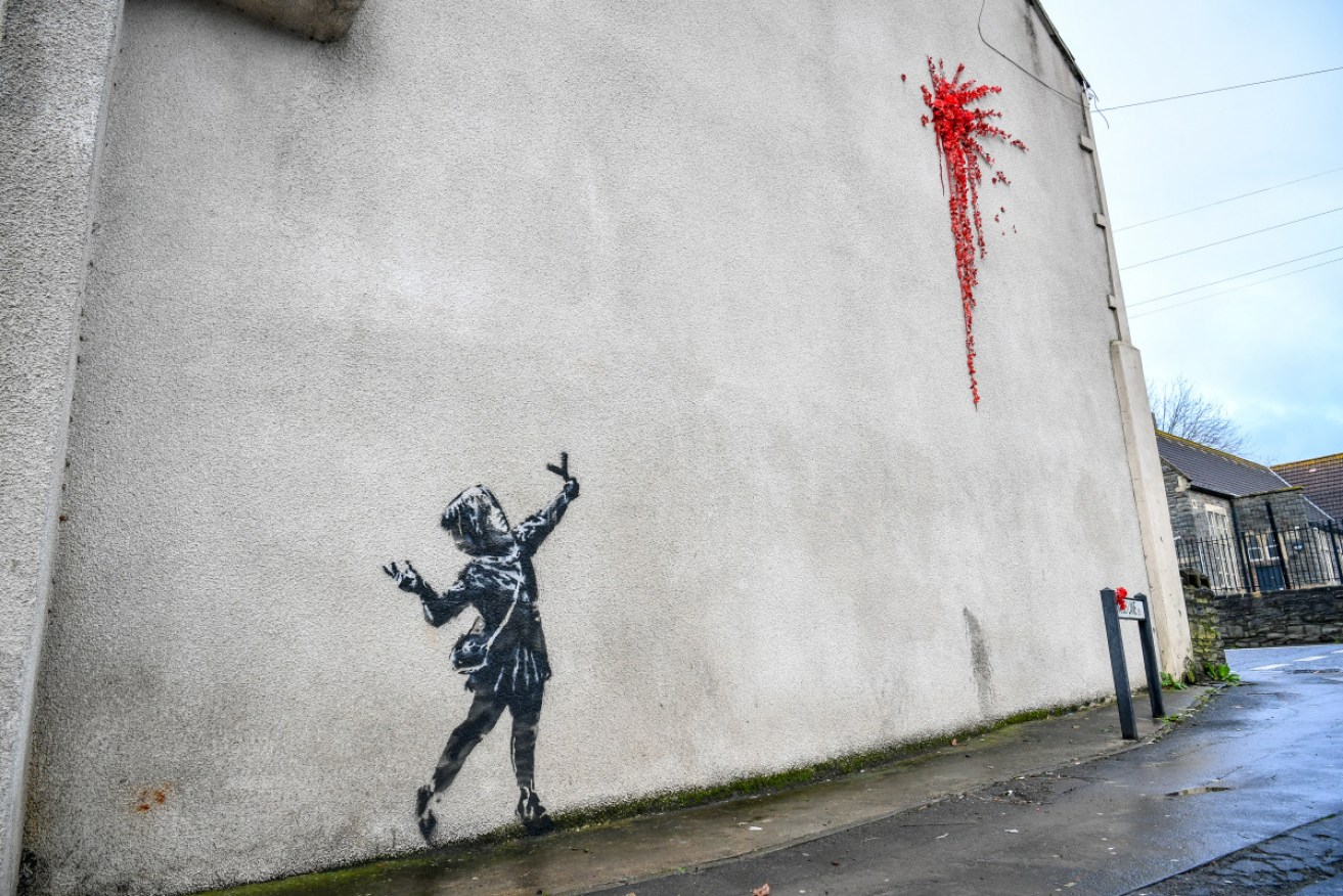 This artwork in Bristol is widely thought to be a Valentine's Day offering by street artist Banksy.