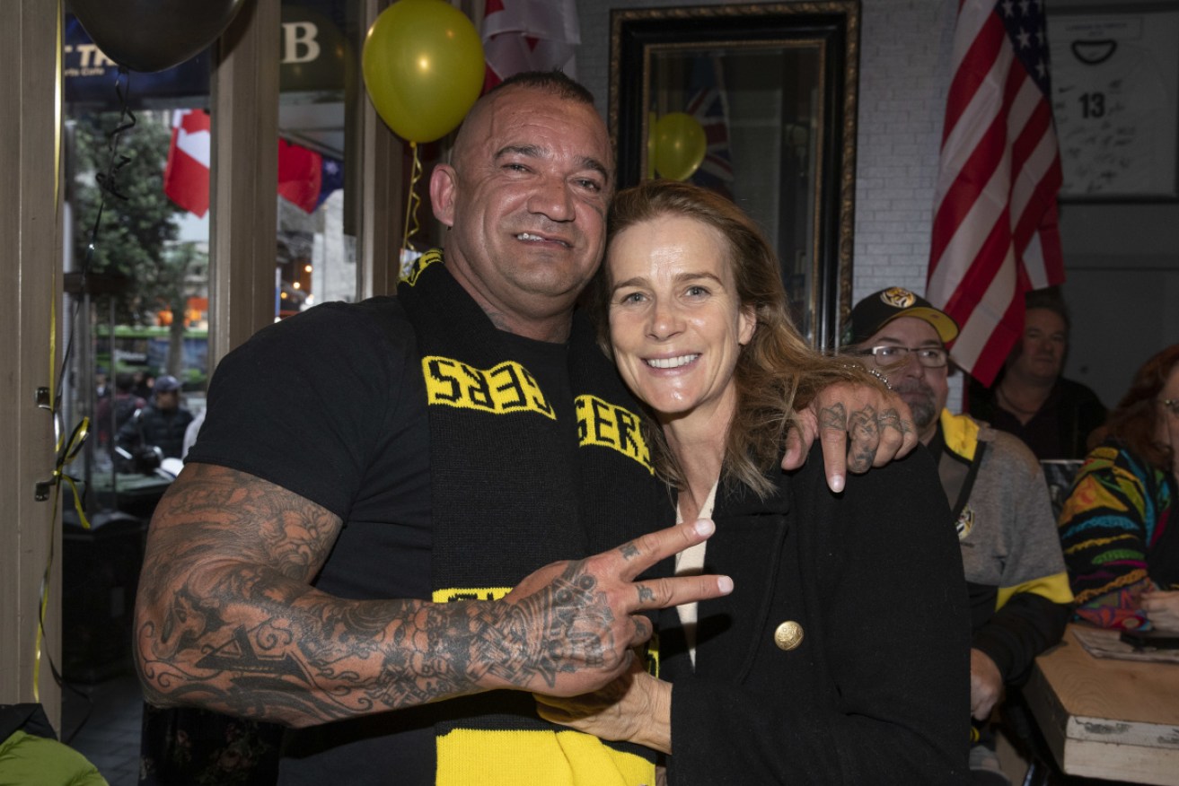 Martin celebrating  Richmond's AFL premiership in 2019 with Rachel Griffiths