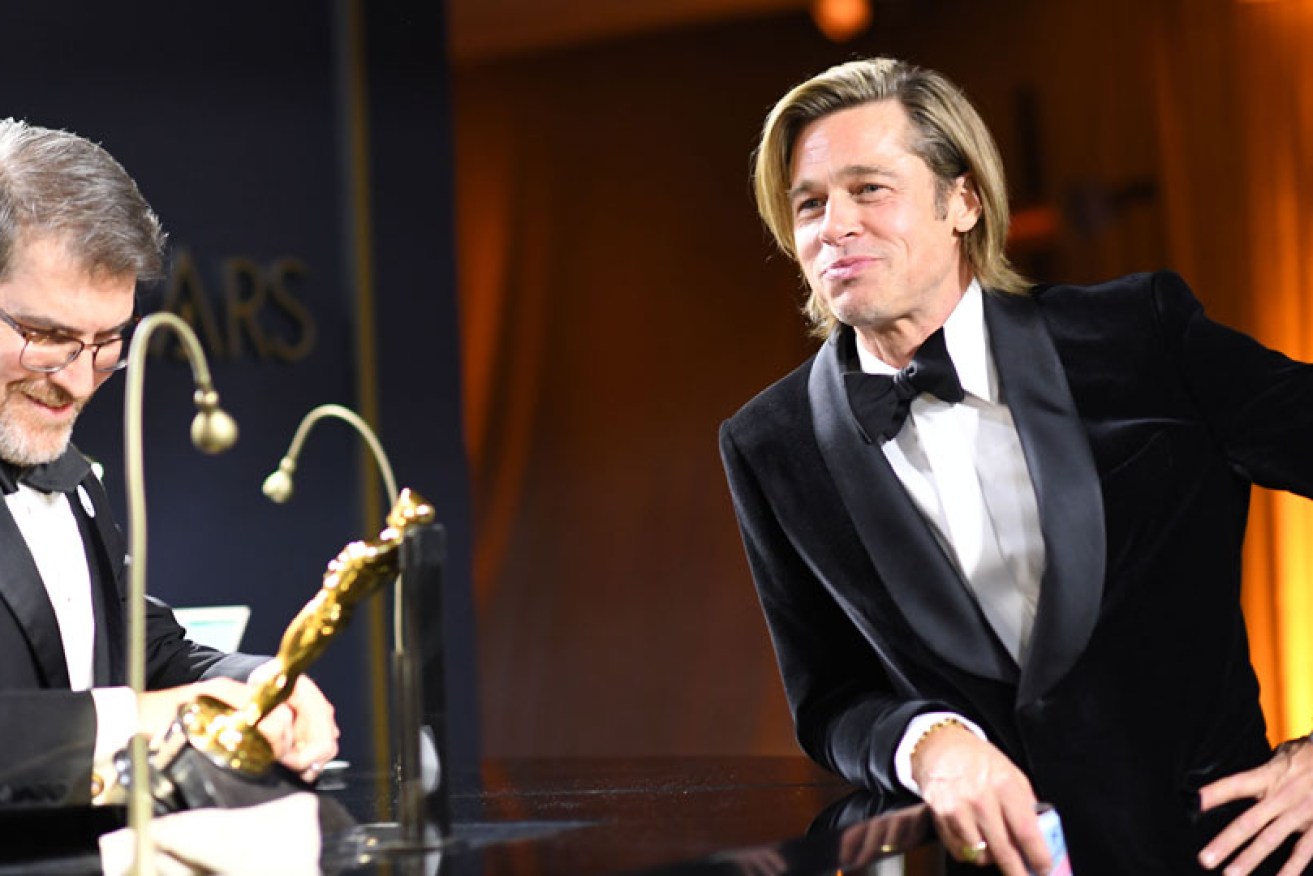 Brad Pitt has his best supporting Oscar engraved at the Governor's Ball in Los Angeles on February 9.