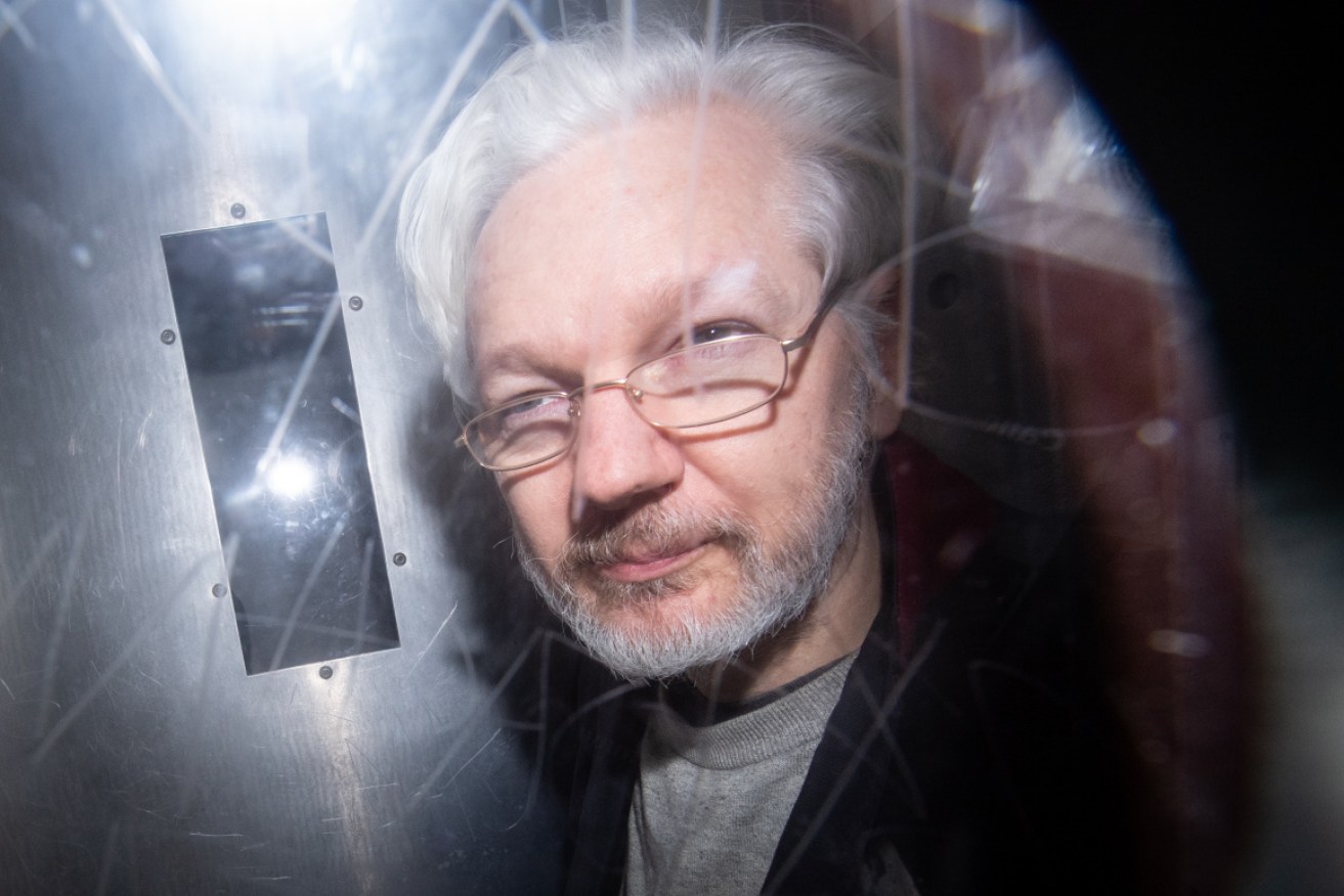 Julian Assange protected informants, a court has heard.
