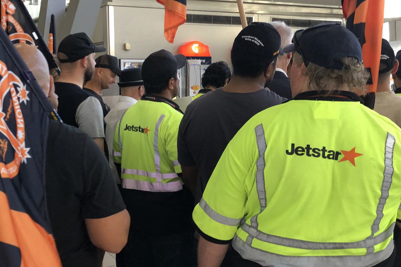Striking Jetstar workers at Sydney airport on Wednesday.