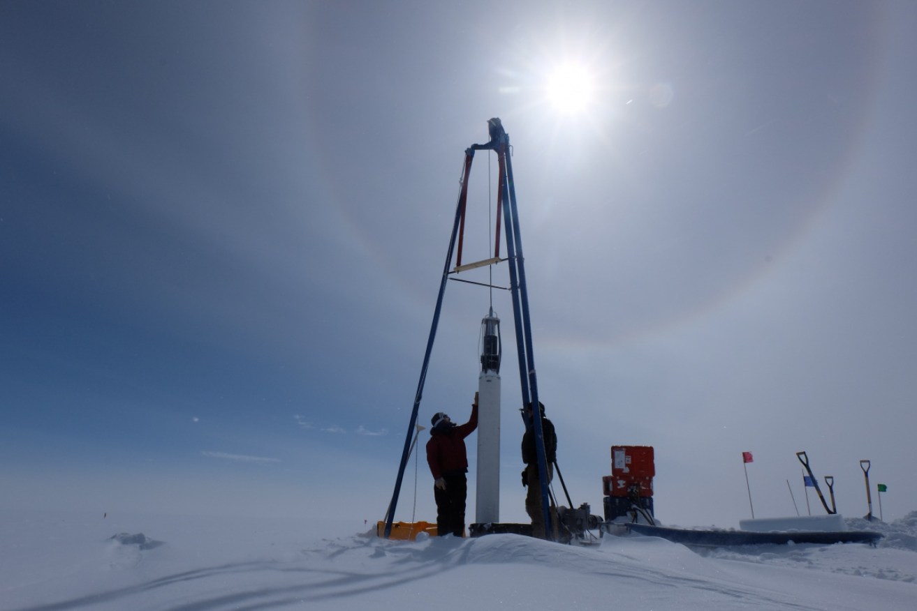 Researchers extract ice samples that contain methane in Greenland. 
