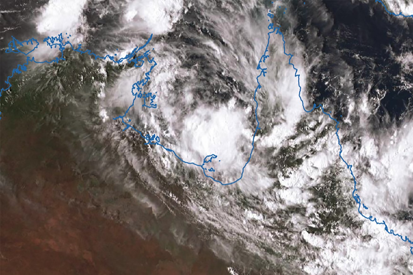 A slow-moving tropical low threatens to develop into Cyclone Esther in the Gulf of Carpentaria near the Northern Territory-Queensland border.