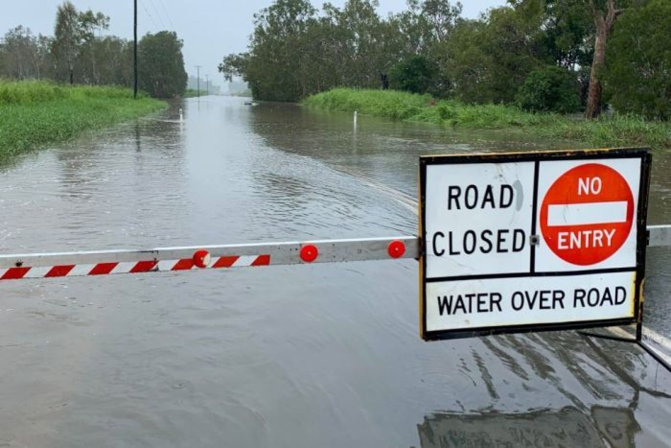 One person was rescued near Mackay after their car became almost completely submerged.