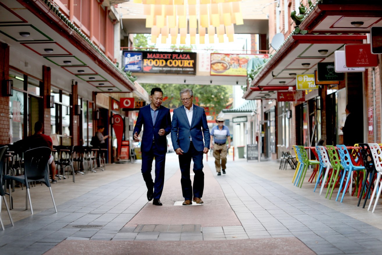 Chinatown Adelaide president Herman Chin and South Australian Governor Hieu Van Le in an almost-empty Adelaide Chinatown.