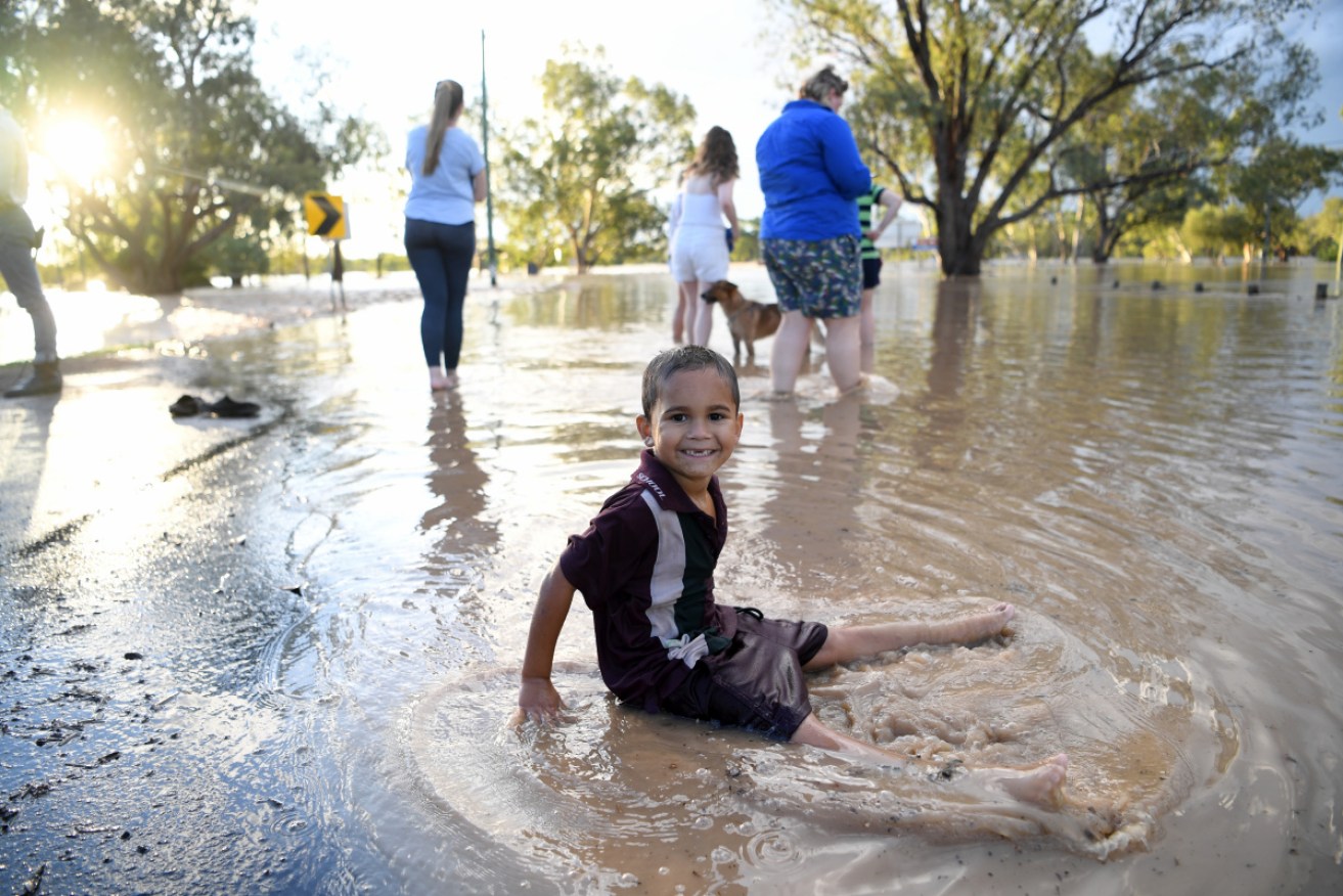 Five-year-old Shaquarn Weribone in the flooded Balonne River at St George.