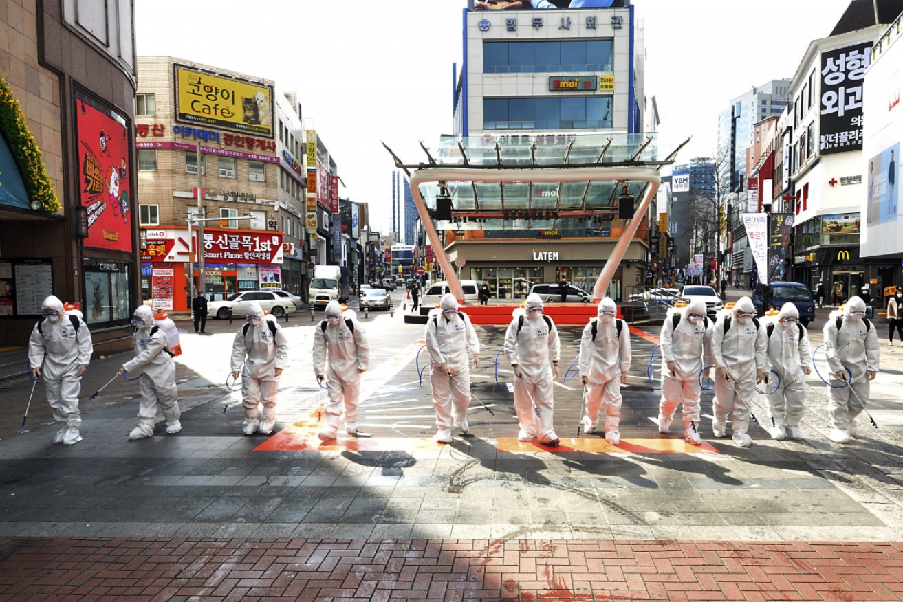 South Korean, where troops in full protective gear disinfect public spaces, understands the importance of vaccine research.<i>Photo: AAP</i>