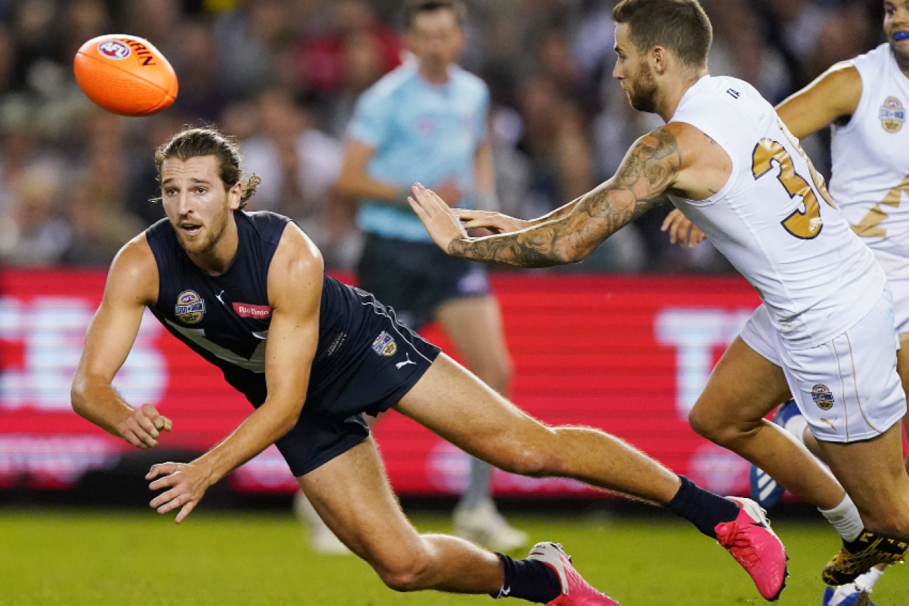 Marcus Bontempelli of Victoria handballs during the Charity State of Origin for Bushfire Relief match.
