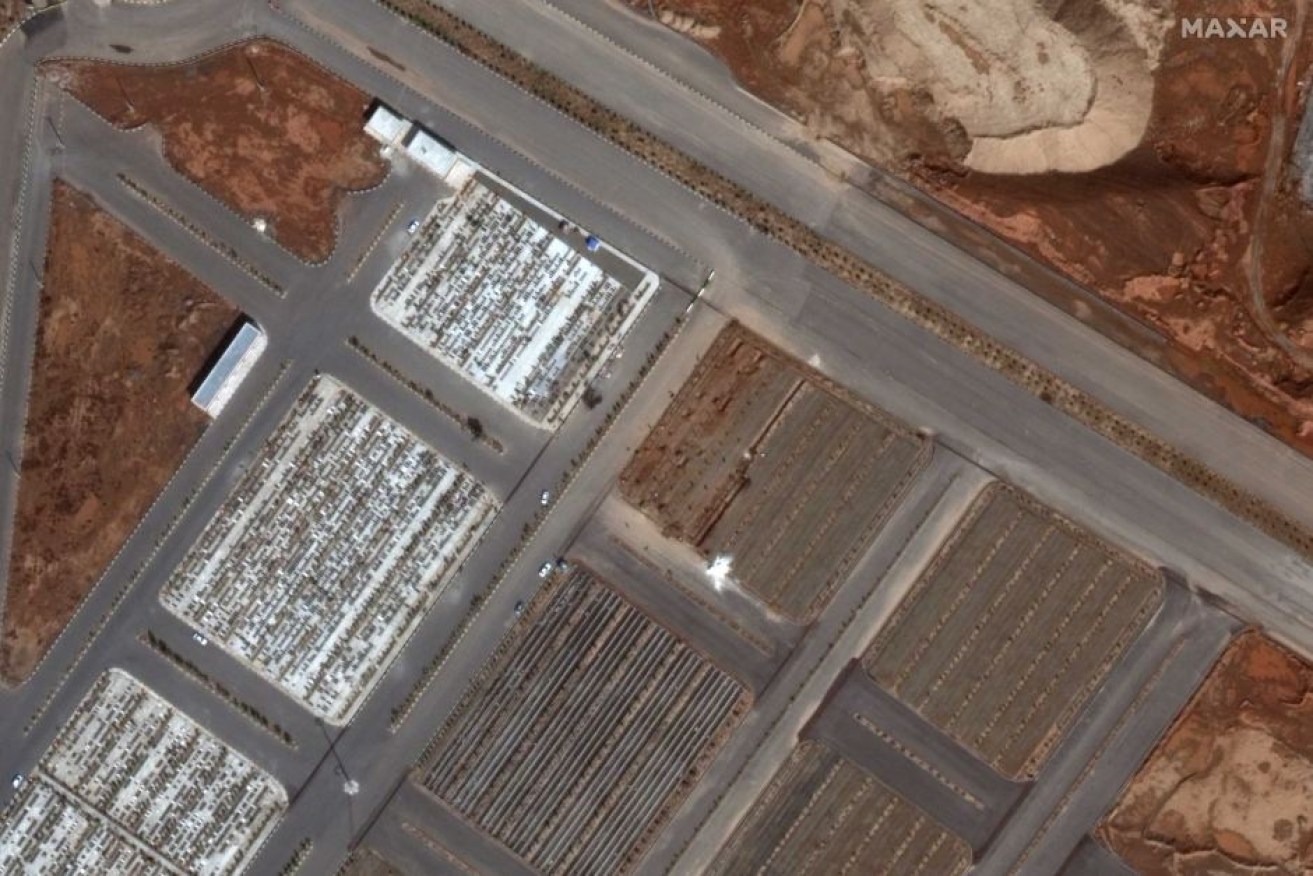 Satellite images show new burial plots at a cemetery in Qom, Iran, early in March.