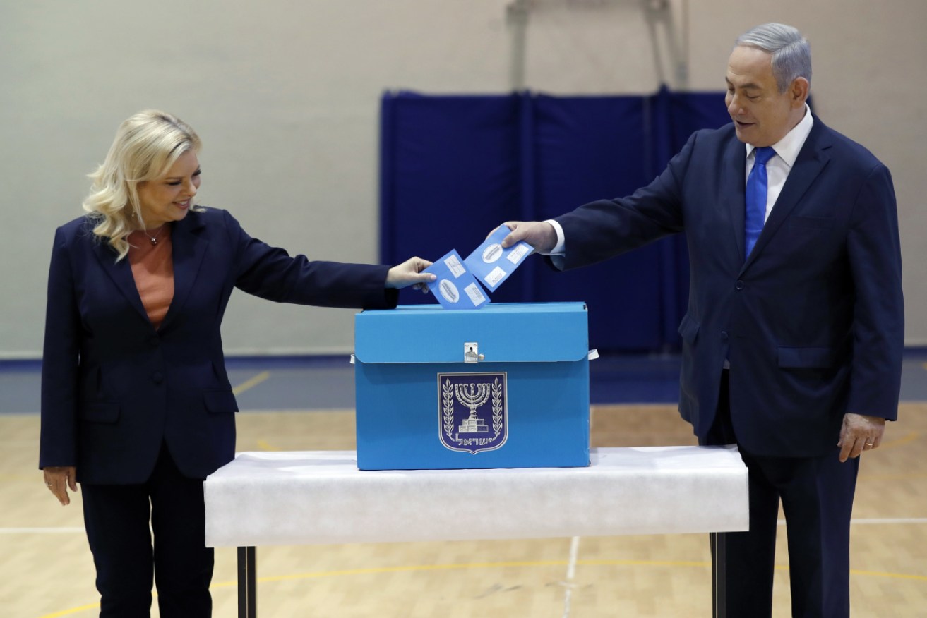 Israeli PM Benjamin Netanyahu and his wife Sara cast their votes in the third national election in 11 months.