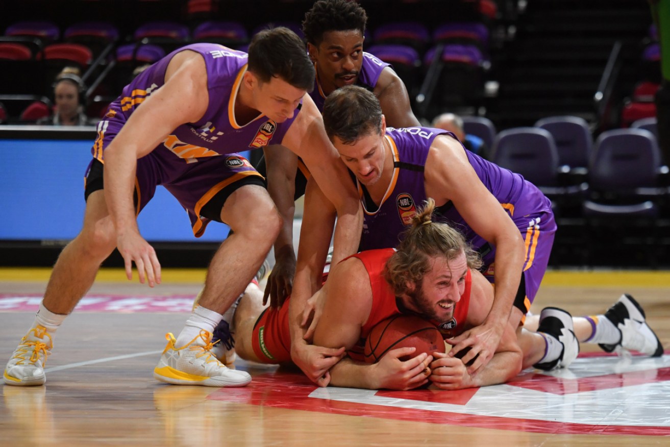 Stacks on: Wildcat Jesse Wagstaff hits the deck during game three of the finals against Sydney Kings. 