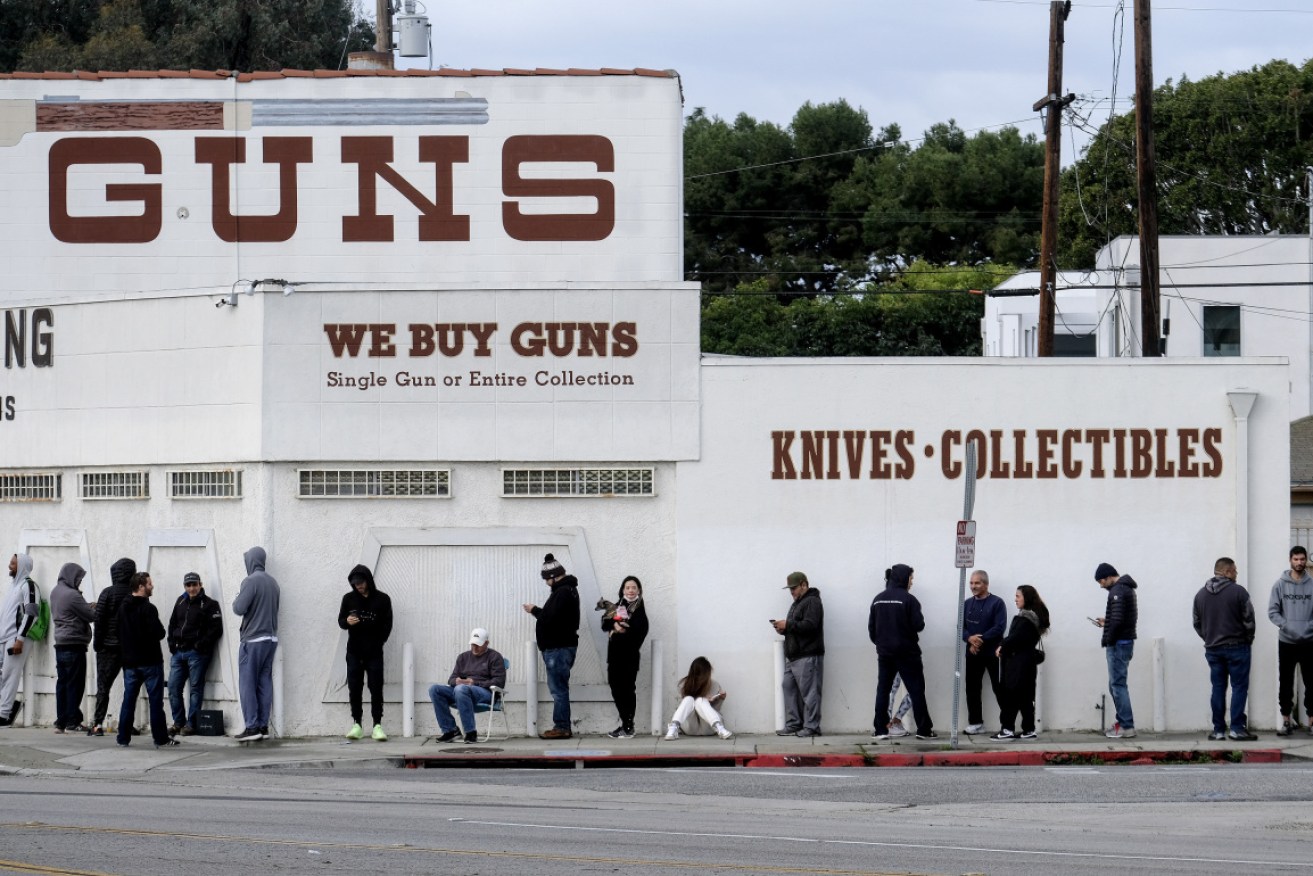 Americans queue outside an LA gun store at the weekend.