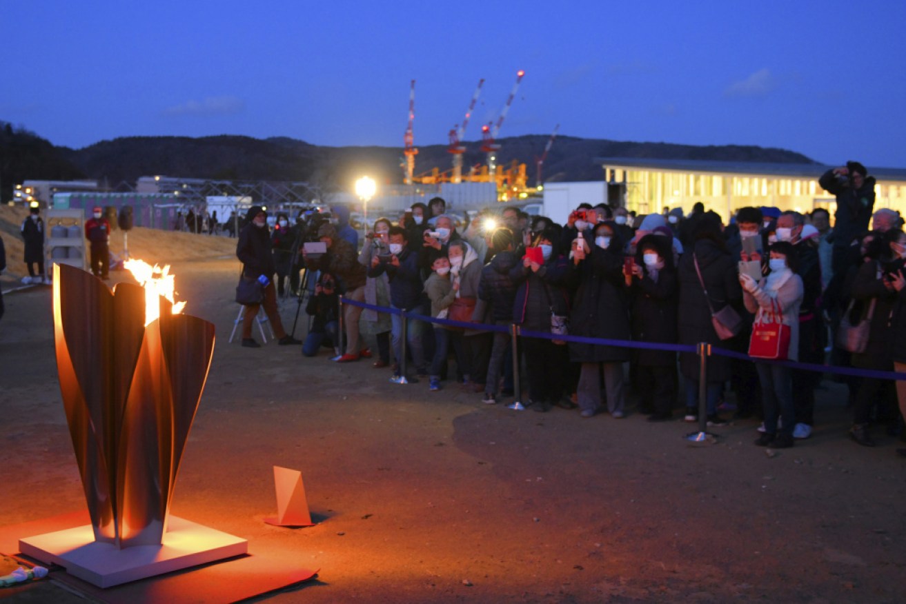 Crowds in a pandemic: The Olympic flame was a big hit at Ishinomaki City this week. 