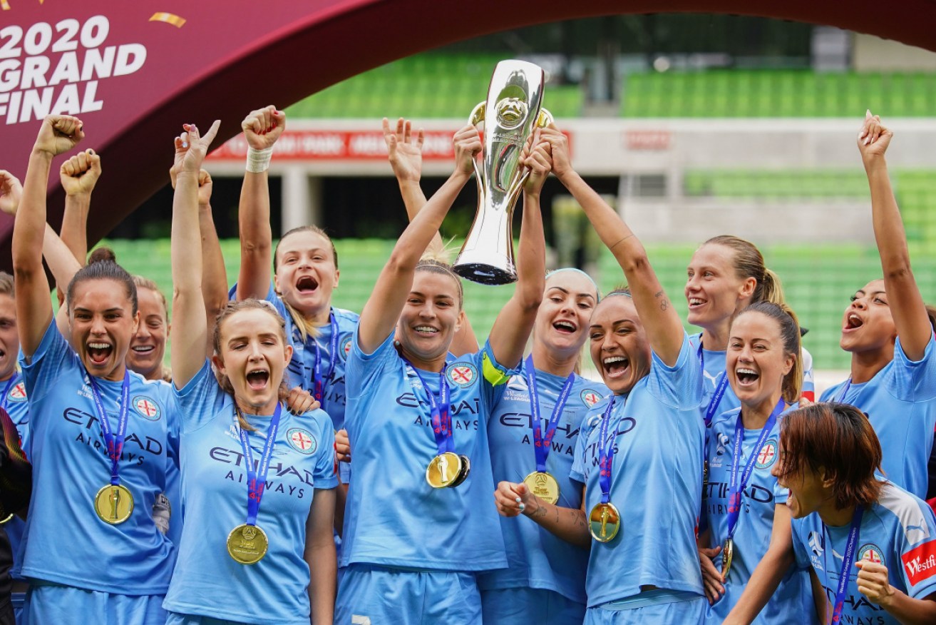 Just in time: Melbourne City players celebrate their 2020 W-League title. 