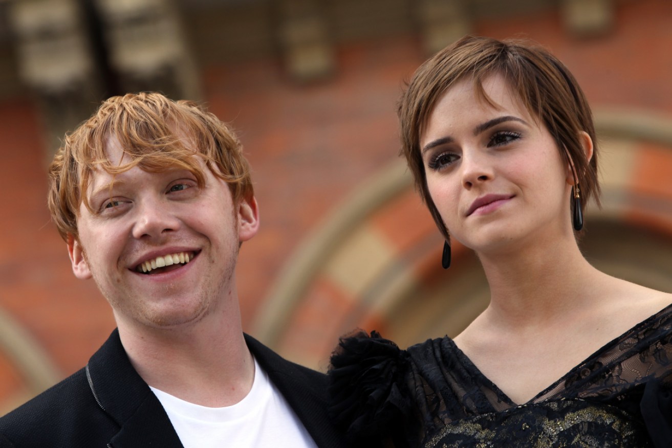 Rupert Grint and Emma Watson pose for photos ahead of the world premiere of Harry Potter and the Deathly Hallows Part 2. Photo: Getty