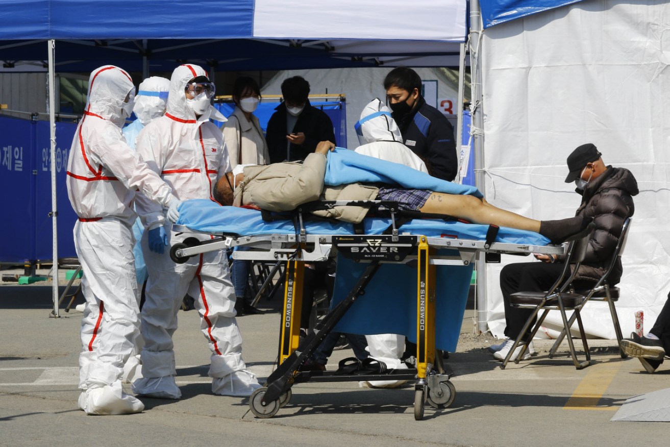 Patients are moved from Daegu medical centre in the western city of Daegu.