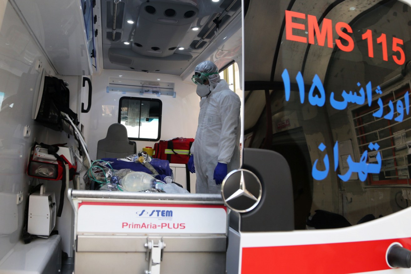 Ambulance staff take a patient to a hospital in Tehran.