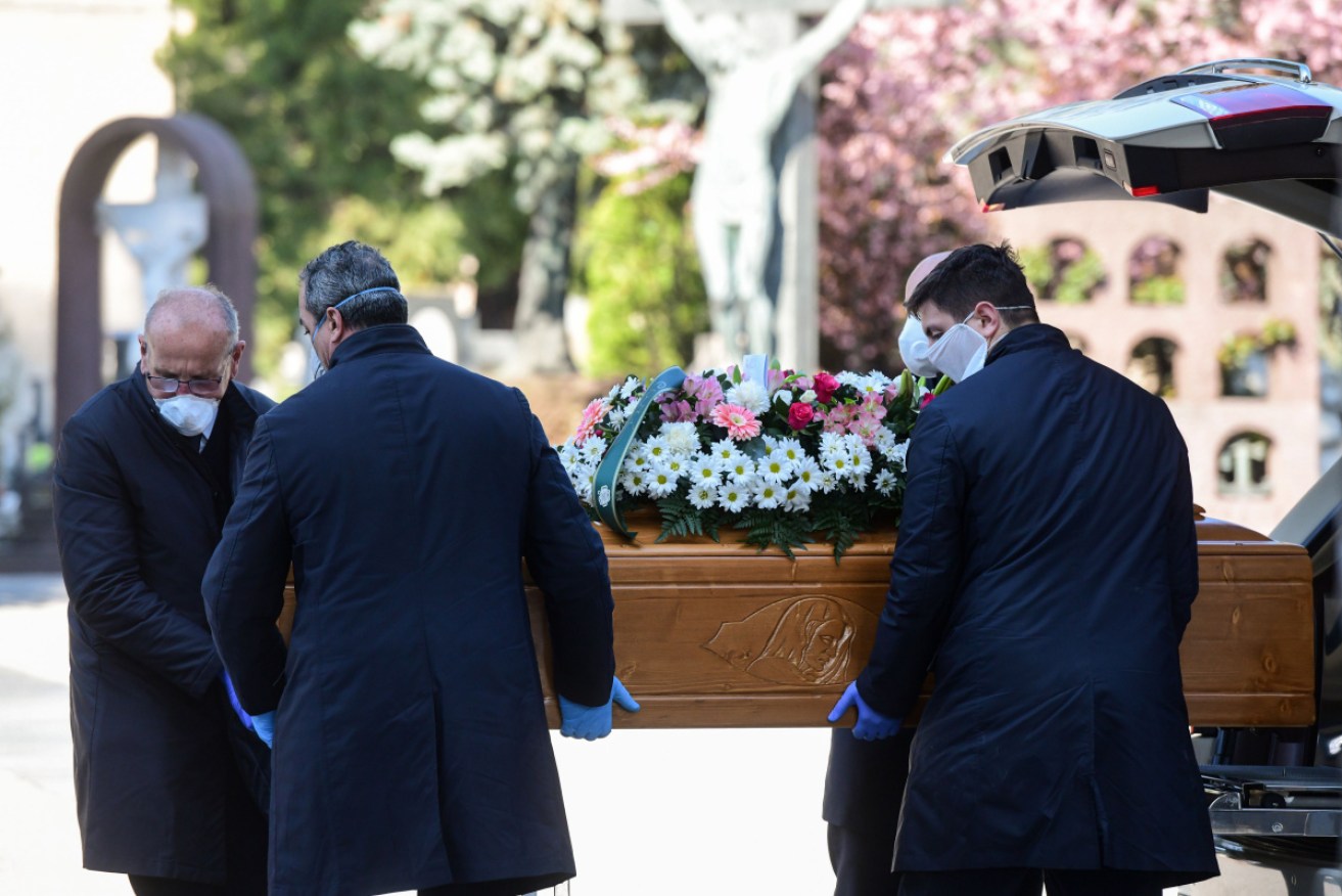 Italians who died from the coronavirus were being buried every half hour last week at the Monumental cemetery of Bergamo. Photo: Getty