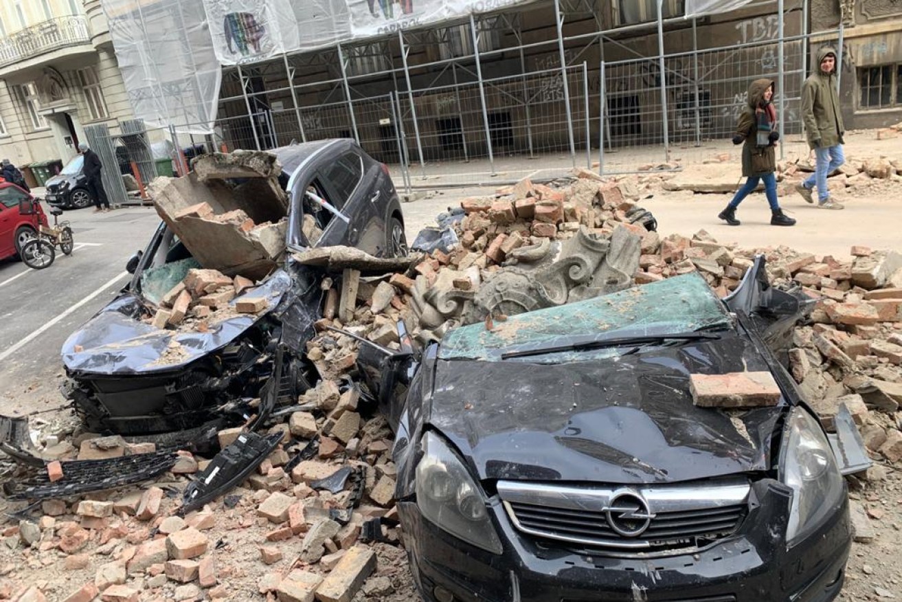 Debris damaged parked cars after spread from buildings following a 5.3 earthquake in Zagreb.