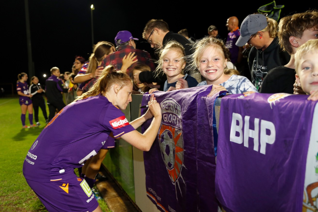 Perth Glory players interact with the crowd following their match with Western Sydney Wanderers.