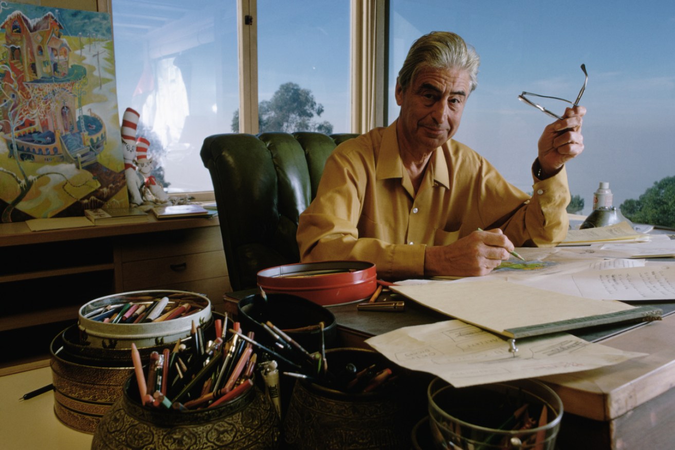 Dr Seuss drawing at his desk in 1969.