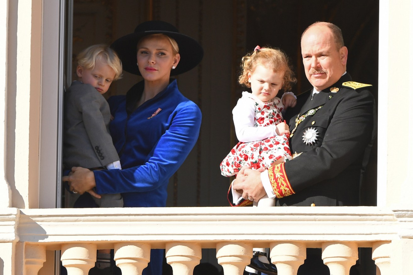 Princess Charlene of Monaco with Prince Jacques of Monaco and Prince Albert II of Monaco with Princess Gabriella.