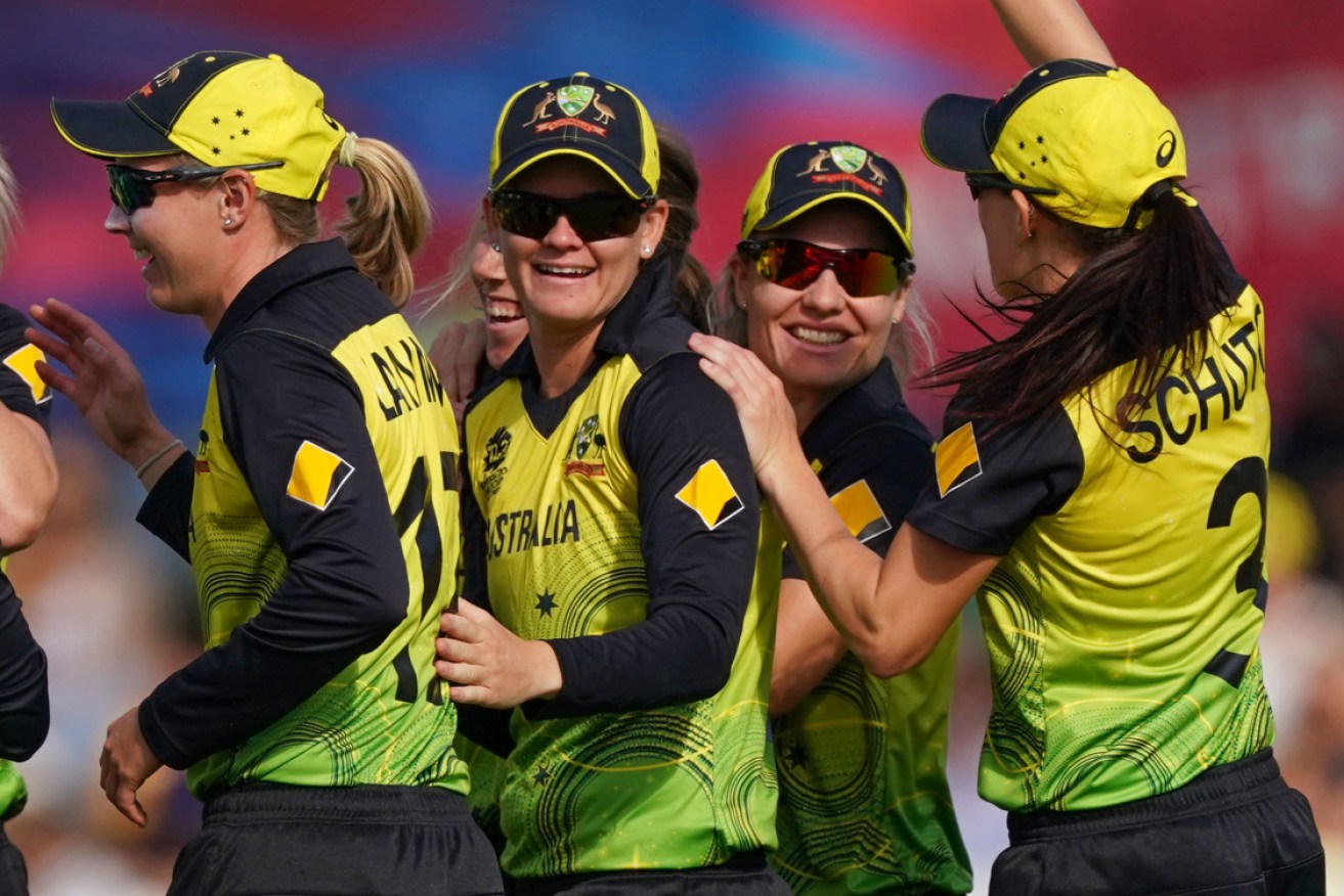 Meg Lanning, Jess Jonassen and Nicola Carey celebrate after dismissing NZ's Suzie Bates at Junction Oval on Monday.