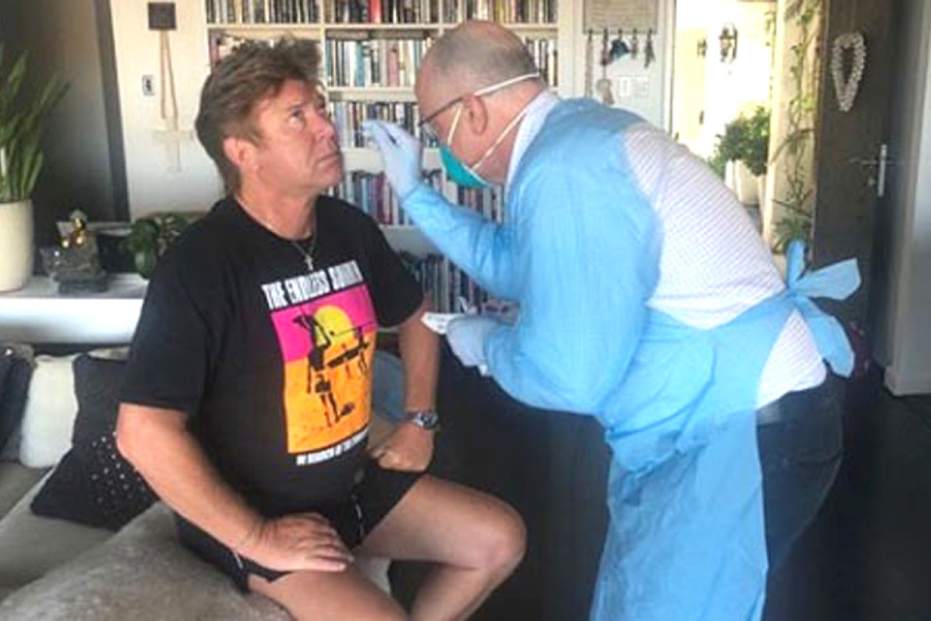 Richard Wilkins is tested for coronavirus. He says he still has no symptoms.