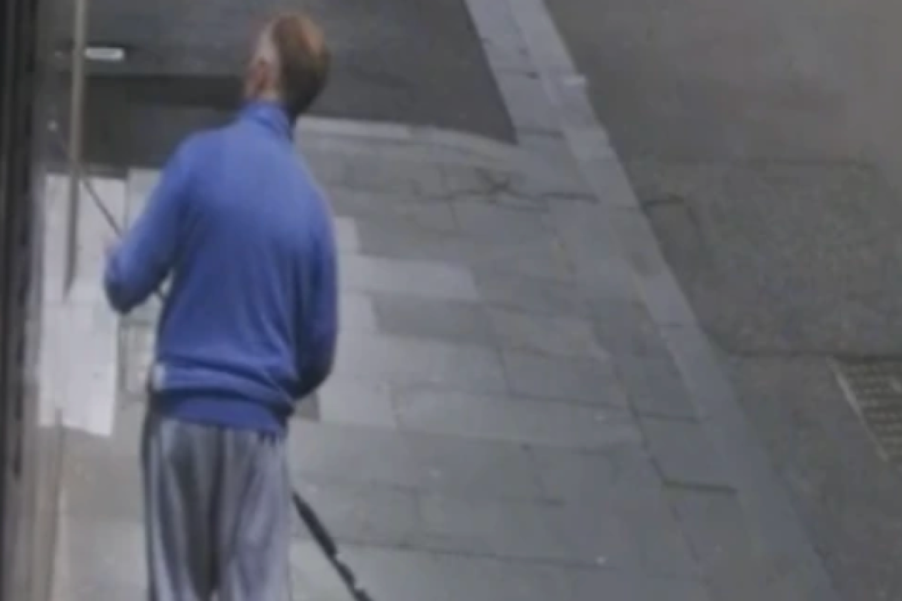 CCTV shows the suspect carrying a fishing rod. Photo: Victoria Police