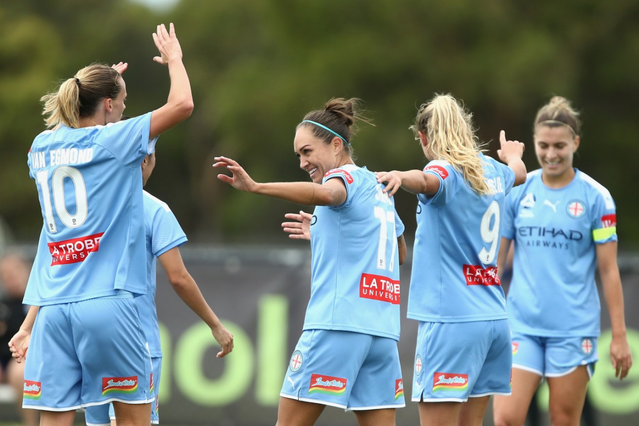 Kyah Simon celebrates one of her goals with her Melbourne City teammates on Sunday. 