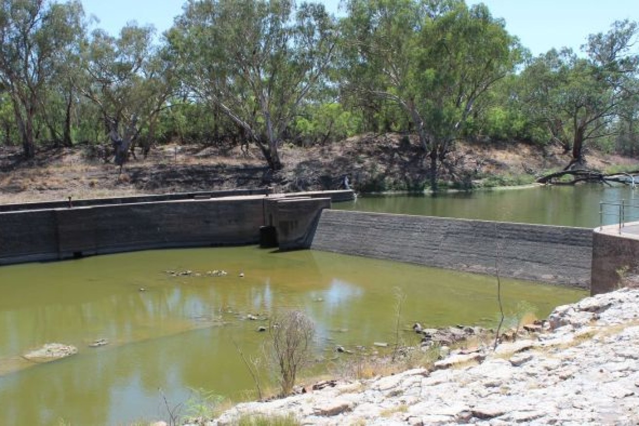 Water stops flowing over the weir at Bourke; that triggers water restrictions.

