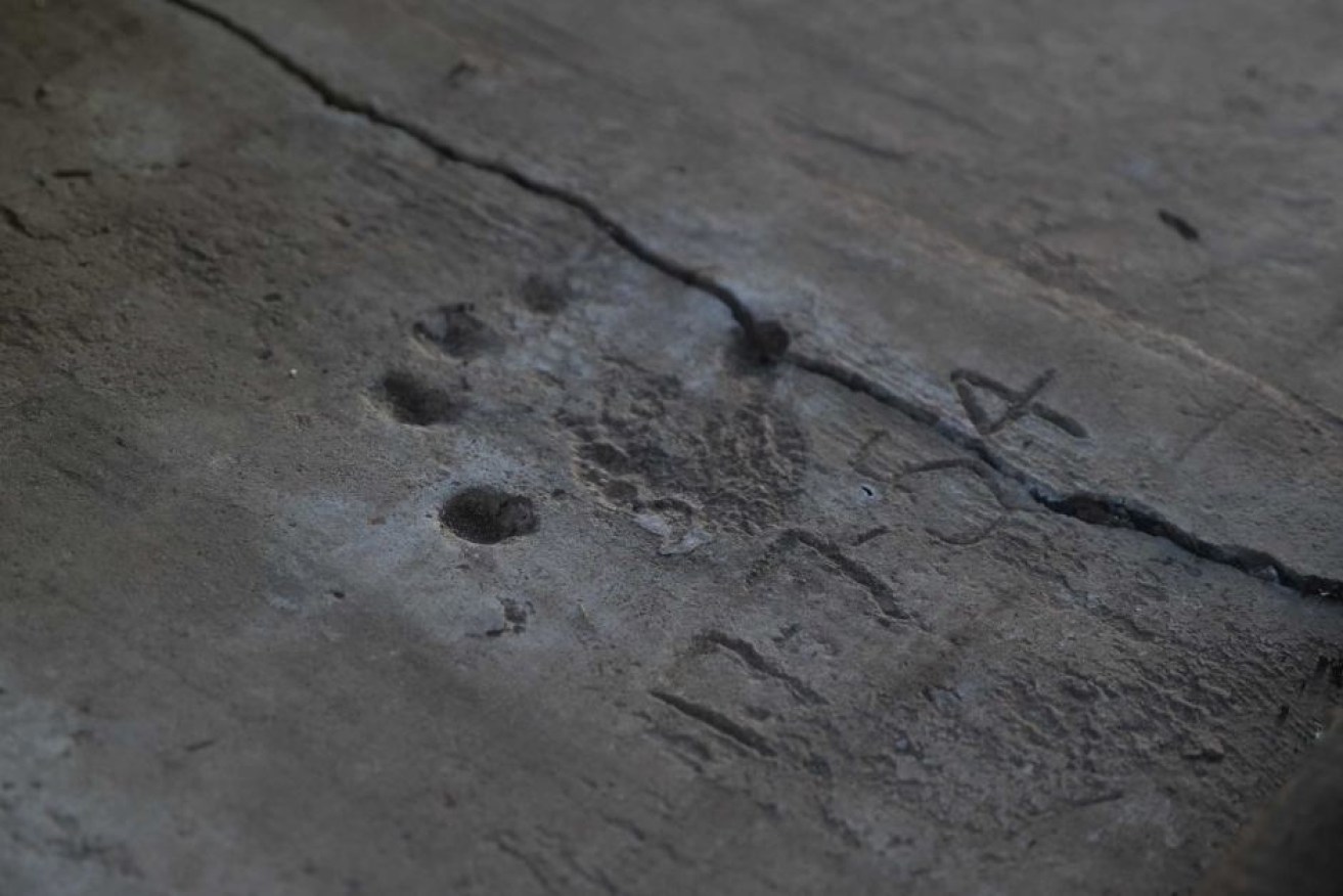 It is believed this handprint was left in 1954 by Ian David Redman.

