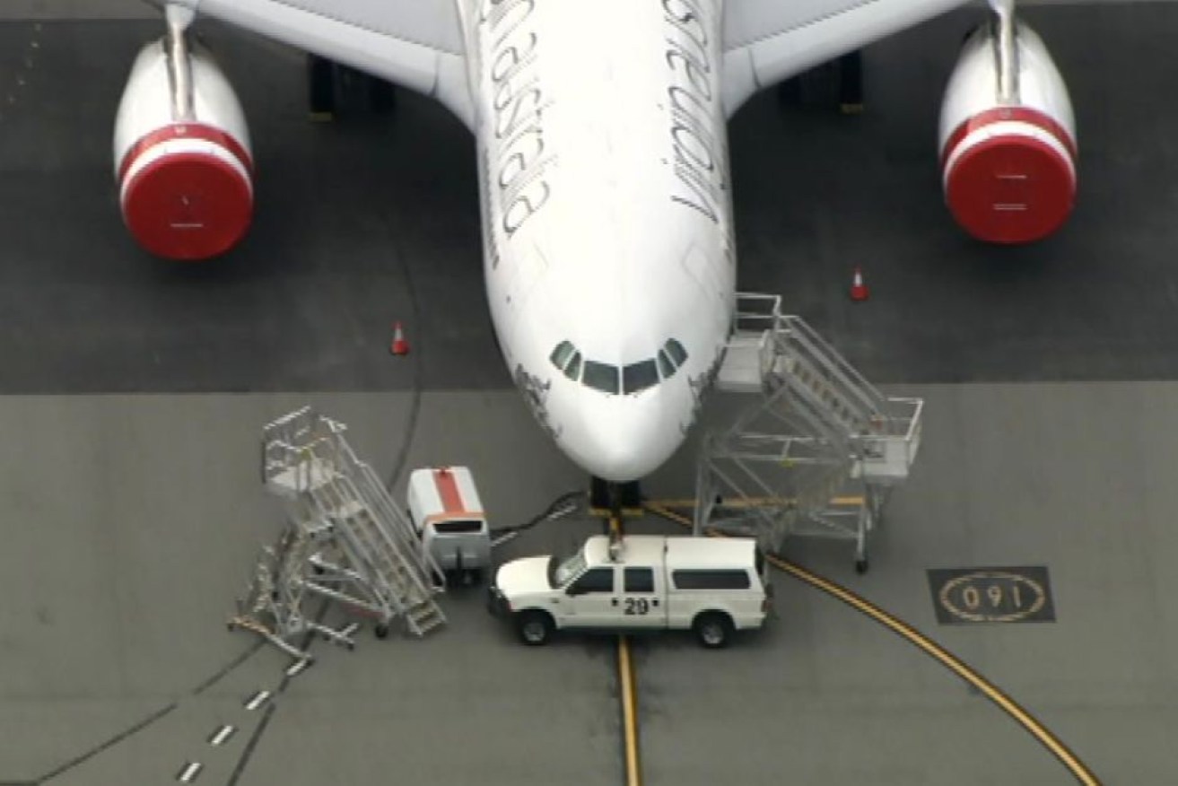 Trucks and other runway items are being used to block Virgin Australia planes at Perth Airport