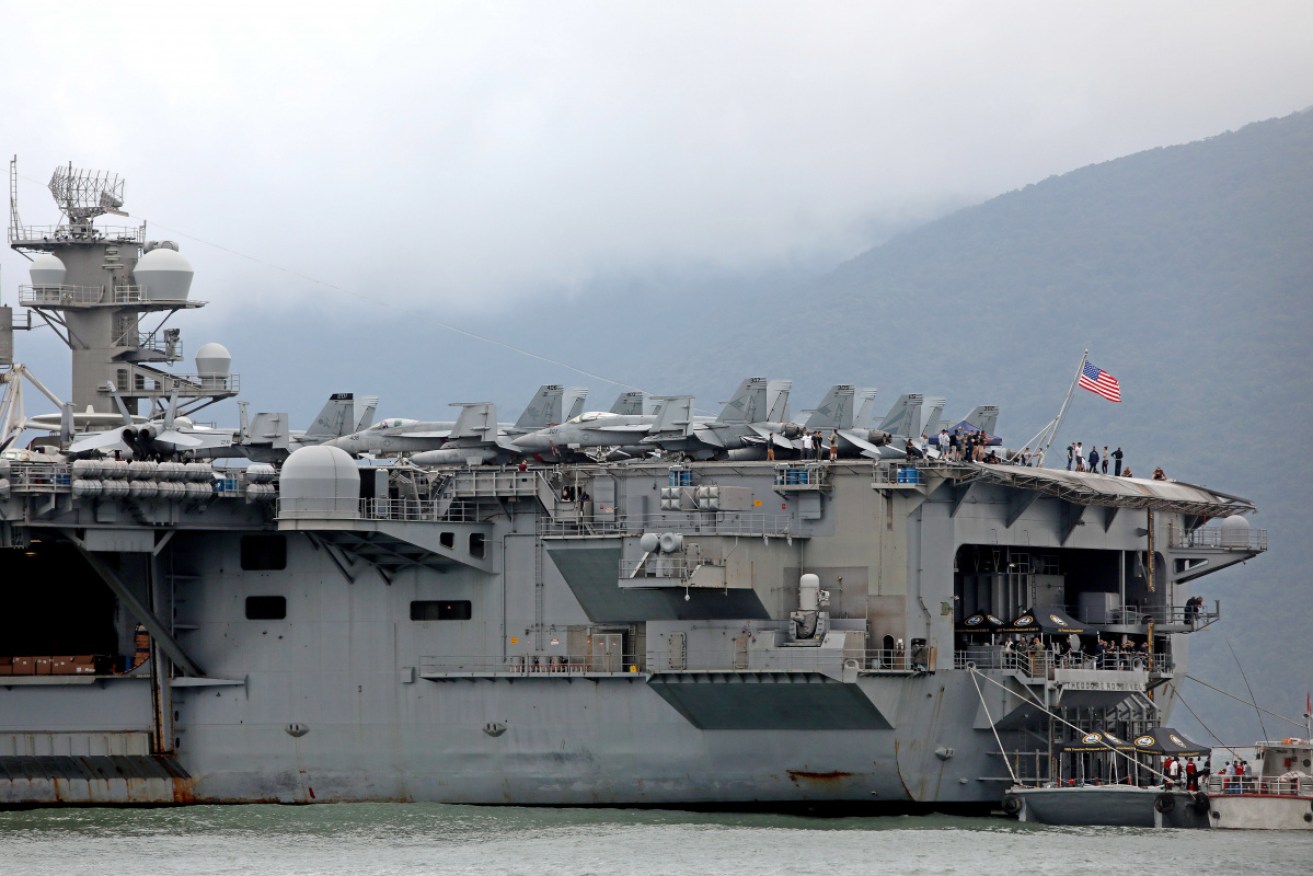 The USS Theodore Roosevelt in Vietnam in early March. It is now moored in Guam, with more than 100 coronavirus cases on board.