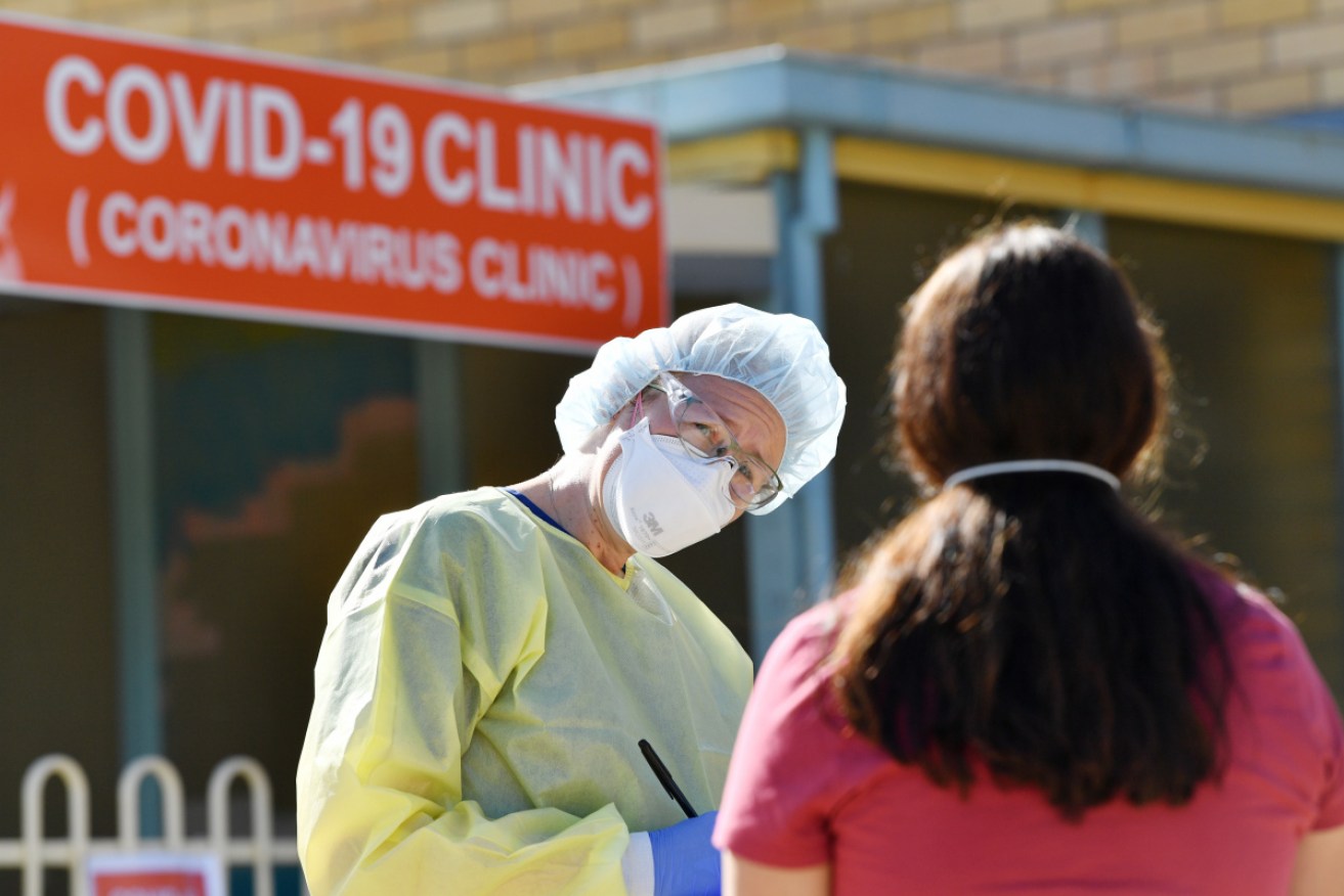 Members of the public seek testing at a coronavirus clinic.
