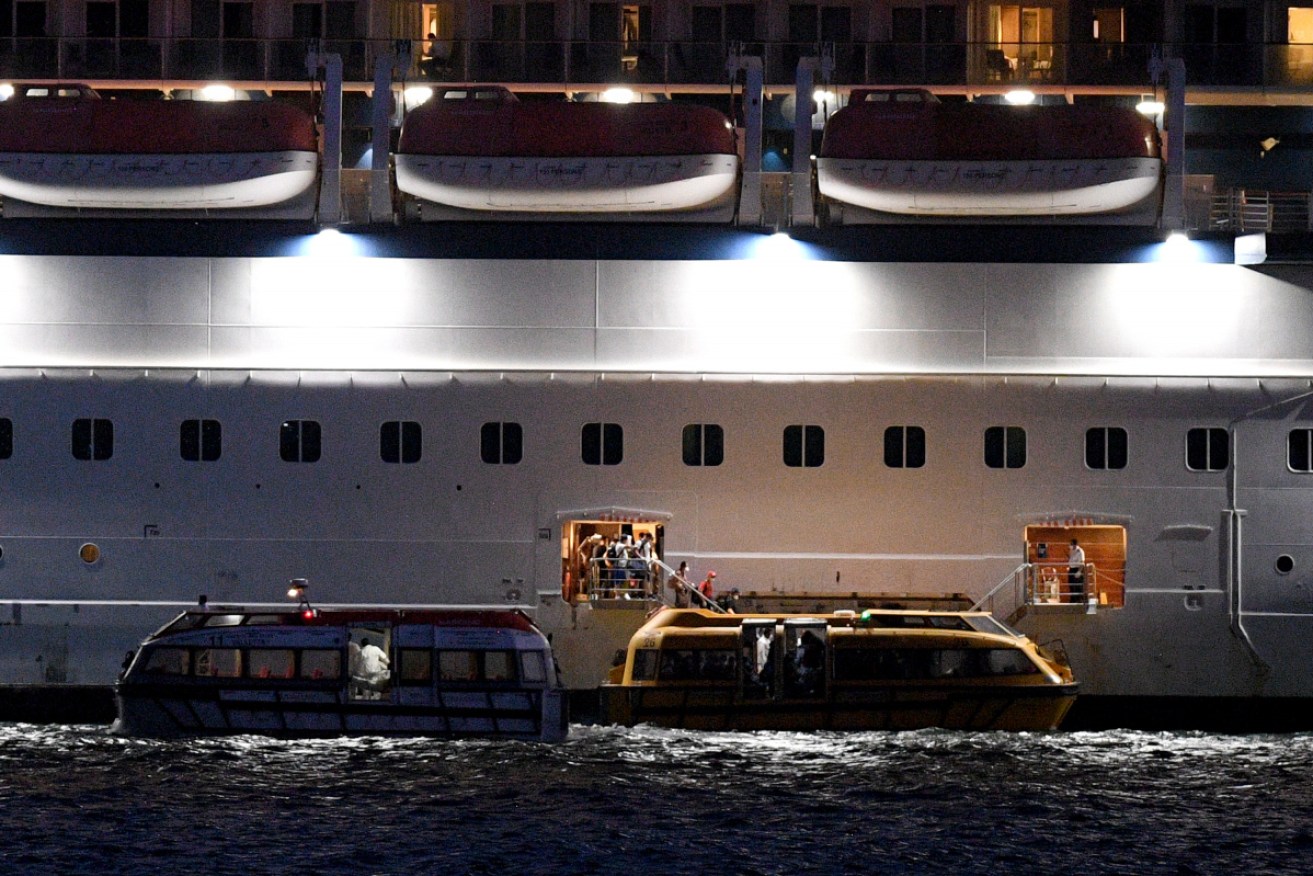 Passengers are transferred to tender craft from the cruise ship Celebrity Solstice in Sydney Harbour.