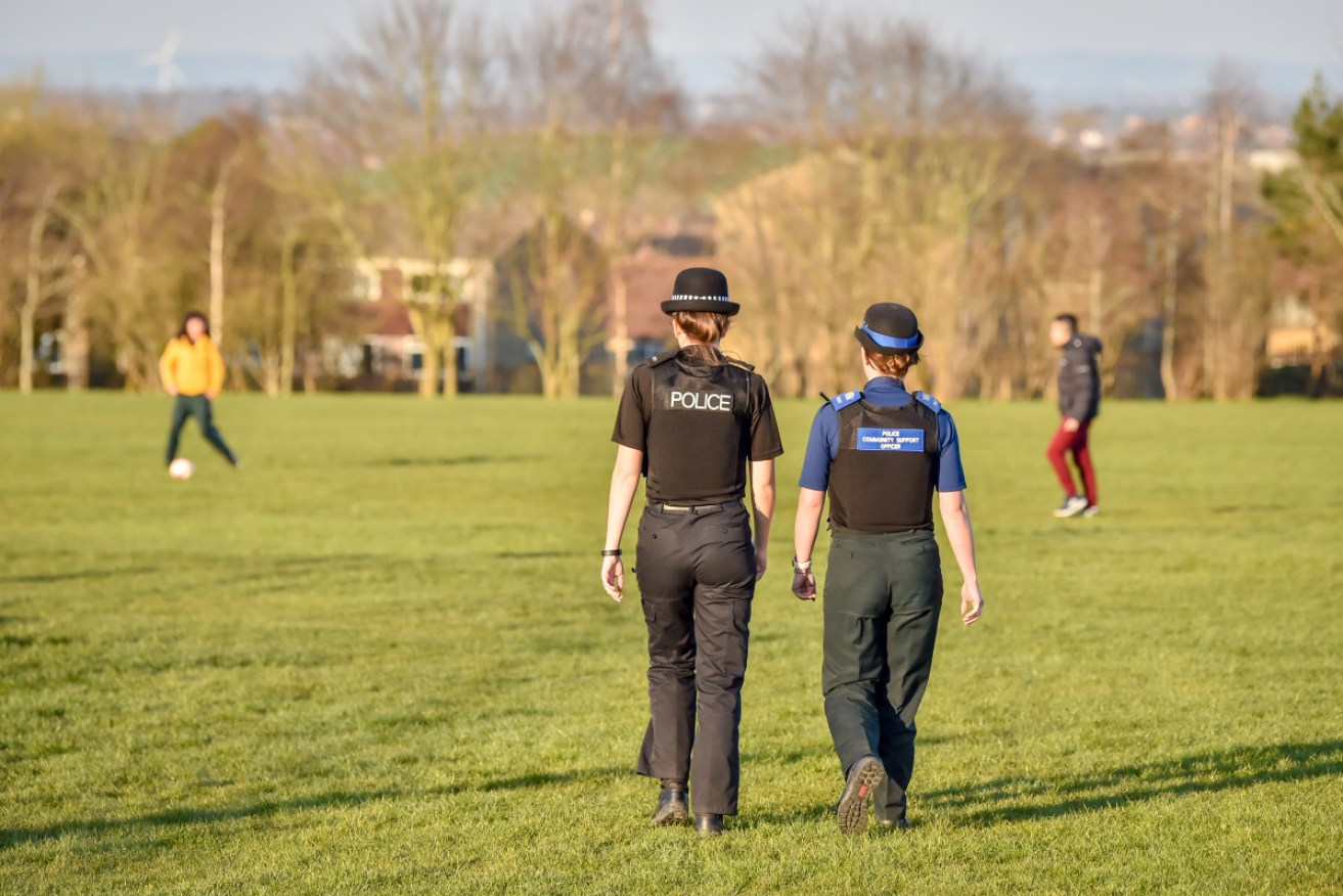 British police officers patrol the parks in Bristol, UK to enforce the coronavirus lockdown rules. 