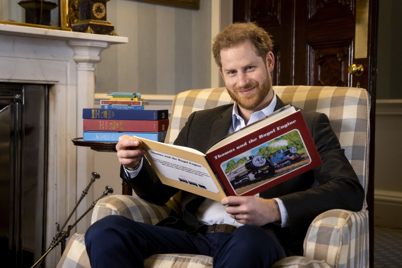 Prince Harry reads the latest Thomas the Tank Engine story. 