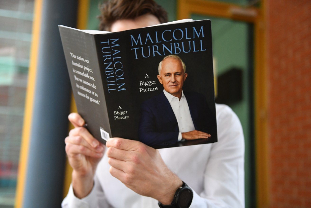 A journalist reads a copy of Malcolm Turnbull's book in Canberra on Monday.