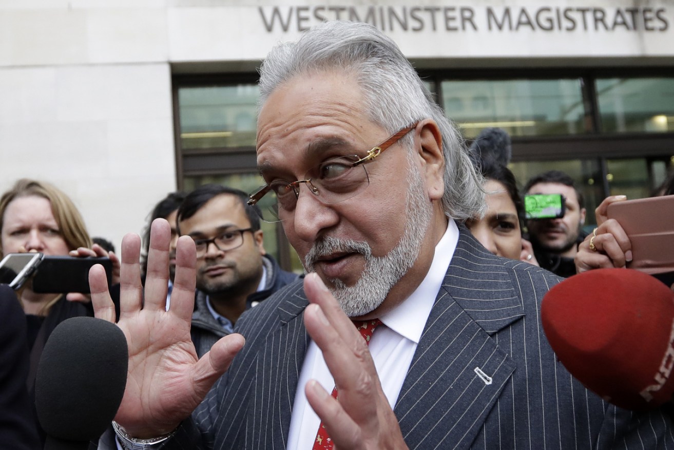 Indian businessman Vijay Mallya leaves Westminster Magistrates Court in London in December 2018. 

