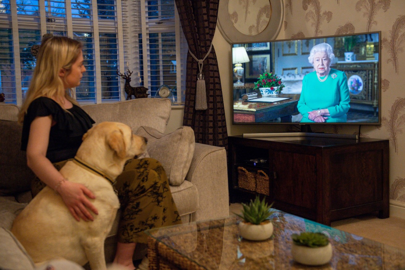 The Doyle family, in the village of Bishop's Itchington in Warwickshire, watch Queen Elizabeth II deliver her address.