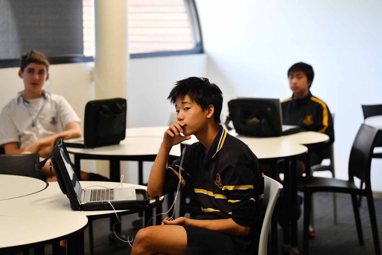 Students prepare for a virtual online learning system at Adelaide's Glenunga High School in Adelaide on April 3.